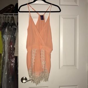 Coral romper with lace detailing